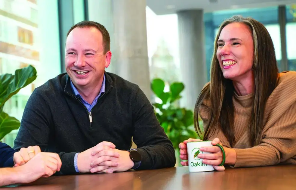 Two Oaklin colleagues talking at a table