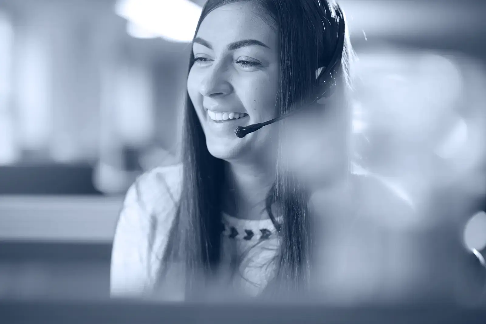 A colleague wearing a headset at St. James’s Place