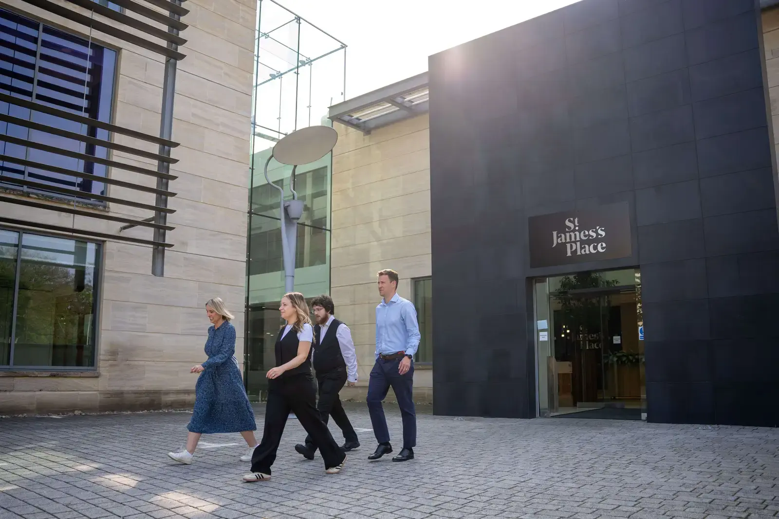 Colleagues walking outside St. James’s Place offices